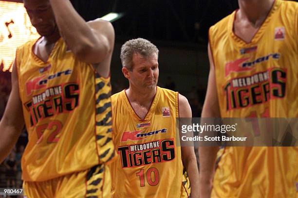 Andrew Gaze of Melbourne Tigers and team mates leave the court dejected after the National Basketball League match between the West Sydney Razorbacks...