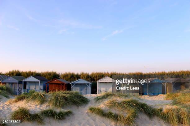 colorful beach huts, west wittering, chichester, west sussex, england, uk - west sussex stock pictures, royalty-free photos & images