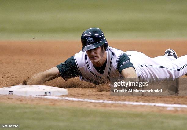 Tampa Bay Devil Rays rookie center fielder Rocco Baldelli slides into third base in the bottom of the seventh inning August 24, 2003 in St....