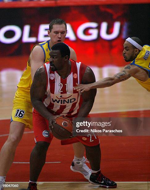 Sofoklis Schortsanitis of Olympiacos Piraeus competes with Adam Lapeta of Asseco Prokom Gdynia during the Euroleague Basketball 2009-2010 Play Off...