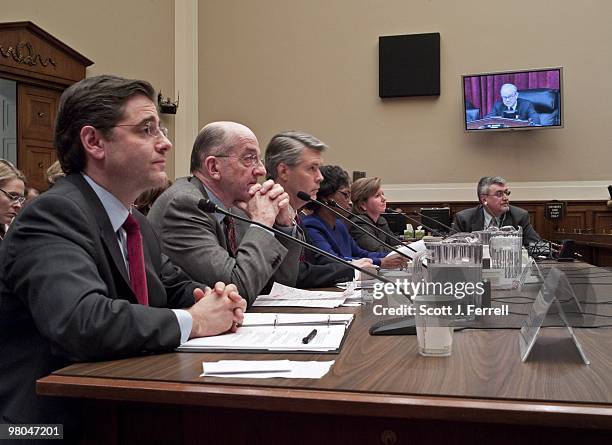 Federal Communications Commission Chairman Julius Genachowski, with FCC commissioners Michael J. Copps, Robert M. McDowell, Mignon Clyburn, and...