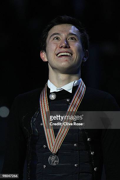 Patrick Chan of Canada poses with his Silver medal on the podium after the Men's Free Skate during the 2010 ISU World Figure Skating Championships on...