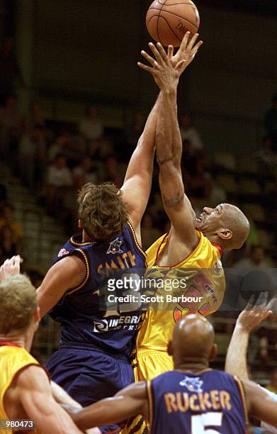 Blair Smith of West Sydney and Clarence Tyson of Melbourne Tigers compete for the ball during the National Basketball League match between the West...