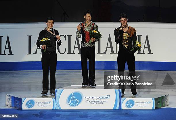 The Silver medalist Patrick Chan of Canada, the Gold medalist Daisuke Takahashi of Japan and the Bronze medalist Brian Joubert of France pose on the...