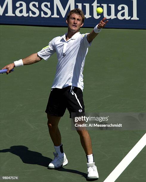 Juan Carlos Ferrero of Spain reaches for a forehand shot during the quarter finals Friday, September 5, 2003 at the U. S. Open, New York. Ferrero...