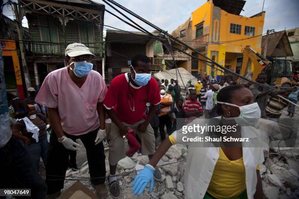 Group of local Haitian rescue workers miraculously pulled a man, still alive, out of the rubble more than 50 hours on January 14, 2010 in Port au...