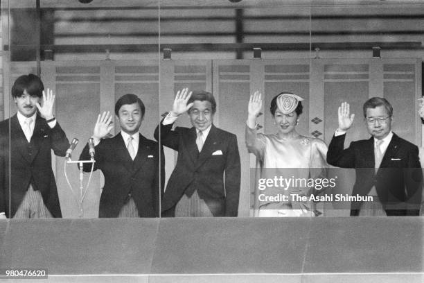 Prince Fumihito, Prince Naruhito, Crown Prince Akihito, Crown Princess Michiko and Prince Hitachi wave to well-wishers from a balcony as Emperor...