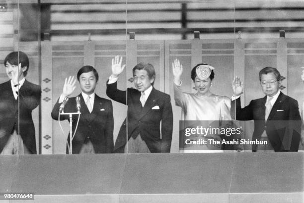 Prince Fumihito, Prince Naruhito, Crown Prince Akihito, Crown Princess Michiko and Prince Hitachi wave to well-wishers from a balcony as Emperor...