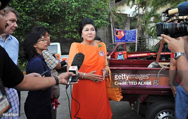 Philippine former first lady Imelda Marcos talks to members of the media after visiting the tomb of her late husband former president Ferdinand...