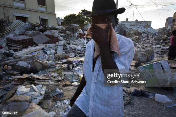 Man walks on a downtown street after destruction has devastated Port Au Prince and much of the country of Haiti on January 14, 2010 in Port au...