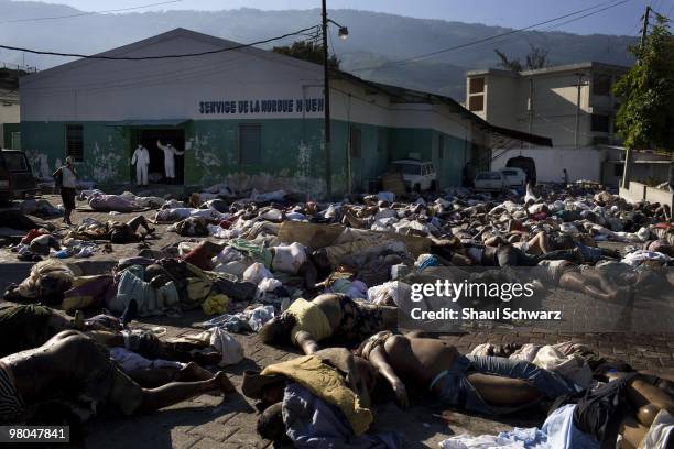 Hundreds of bodies are piled up outside the main morgue in the general hospital of Port Au Prince following a massive 7.0 earthquake on January 15,...