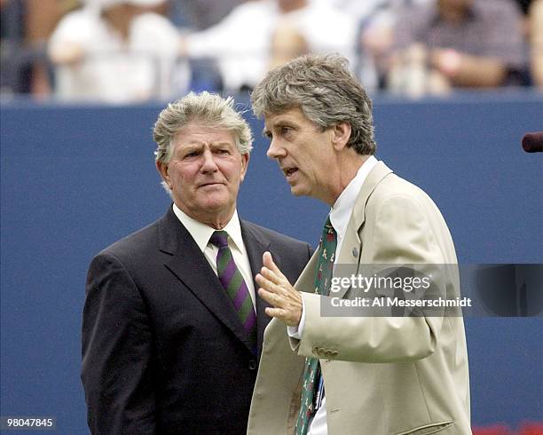 Tournament supervisor Alan Mills and tournament referee Brian Earley discuss a rain delay. Saturday, August 30, 2003 at the 2003 U.S. Open in Queens,...