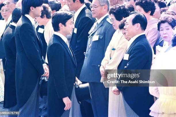 Prince Naruhito talks singer Haruo Minami during the spring garden party at the Akasaka Imperial Garden on May 20, 1987 in Tokyo, Japan.