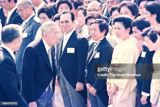 Emperor Hirohito talks with guests during the spring garden party at the Akasaka Imperial Garden on May 20, 1987 in Tokyo, Japan.
