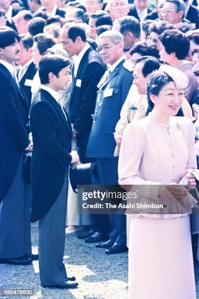 Prince Naruhito talks singer Haruo Minami during the spring garden party at the Akasaka Imperial Garden on May 20, 1987 in Tokyo, Japan.