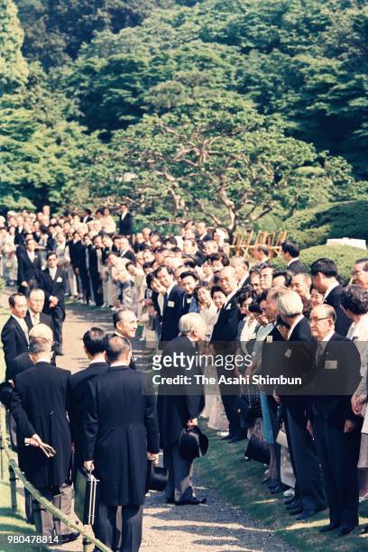 Emperor Hirohito talks with guests during the spring garden party at the Akasaka Imperial Garden on May 20, 1987 in Tokyo, Japan.