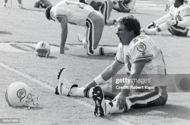 Dan Marino of the Miami Dolphins yawns while stretching before a game in the 1994 season.