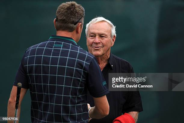Arnold Palmer of the USA says hello to Robert Allenby of Australia on the course during the first round of the Arnold Palmer Invitational presented...