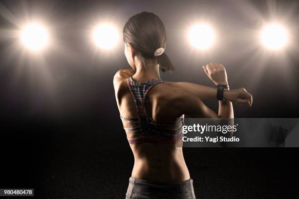 female athlete standing in studio - athlete bulges stock pictures, royalty-free photos & images