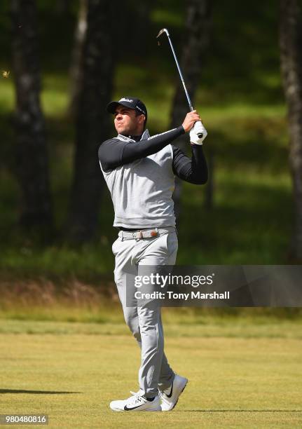 Dimitrios Papadatos of Australia plays his second shot on the 17th fairway during Day One of the SSE Scottish Hydro Challenge hosted by Macdonald...