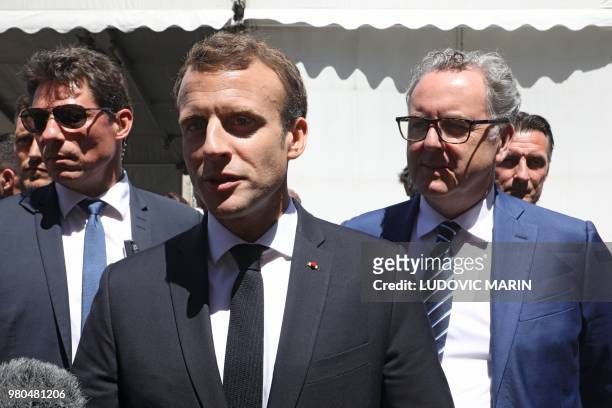French President Emmanuel Macron and President of the La Republique en Marche parliamentary group, Richard Ferrand speak with journalists as they...