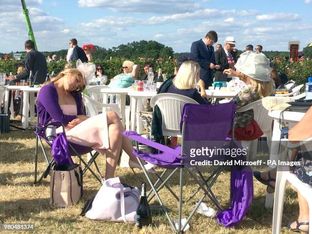 Woman resting her eyes during day three of Royal Ascot at Ascot Racecourse.
