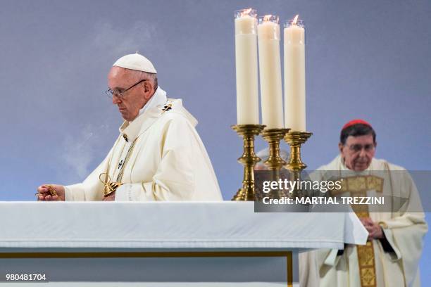 Pope Francis celebrates a mass with Swiss Cardinal Kurt Koch, during his one-day visit at the invitation of the World Council of Churches on June 21,...
