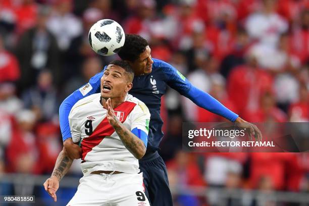 Peru's forward Paolo Guerrero and France's defender Raphael Varane compete for the ball during the Russia 2018 World Cup Group C football match...