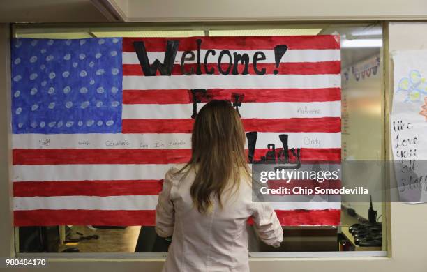 First lady Melania Trump signs a welcome poster made for her after a round table discussion with doctors and social workers at the Upbring New Hope...