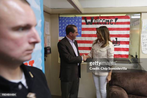 First lady Melania Trump shakes hands with HHS Secretary Alex Azar during a visit for a round table discussion with doctors and social workers at the...