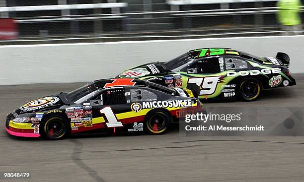 Jamie McMurray passes Jeremy Mayfield to hold the lead and win the NASCAR Busch series Target House 200 at North Carolina Speedway Saturday November...