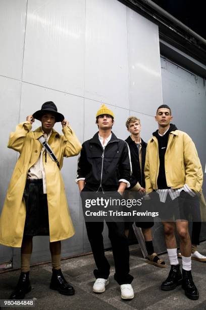 Models pose backstage prior the Ami Alexandre Mattiussi Menswear Spring Summer 2019 show as part of Paris Fashion Week on June 21, 2018 in Paris,...