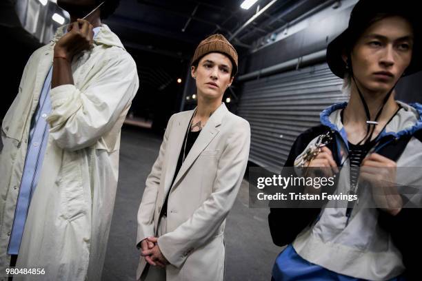 Models pose backstage prior the Ami Alexandre Mattiussi Menswear Spring Summer 2019 show as part of Paris Fashion Week on June 21, 2018 in Paris,...