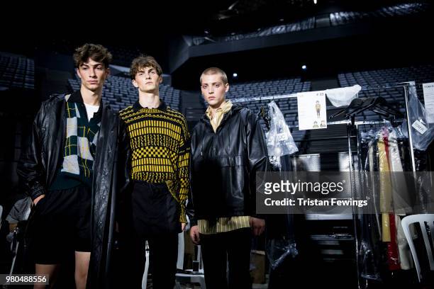 Models pose backstage prior the Ami Alexandre Mattiussi Menswear Spring Summer 2019 show as part of Paris Fashion Week on June 21, 2018 in Paris,...