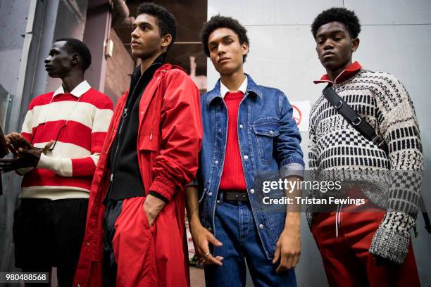 Models pose backstage prior the Ami Alexandre Mattiussi Menswear Spring Summer 2019 show as part of Paris Fashion Week on June 21, 2018 in Paris,...