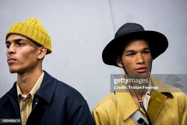 Models pose backstage prior the Ami Alexandre Mattiussi Menswear Spring Summer 2019 show as part of Paris Fashion Week on June 21, 2018 in Paris,...