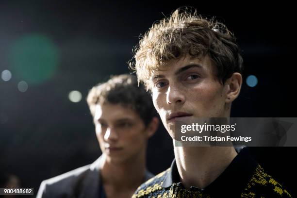 Models pose backstage prior the Ami Alexandre Mattiussi Menswear Spring Summer 2019 show as part of Paris Fashion Week on June 21, 2018 in Paris,...