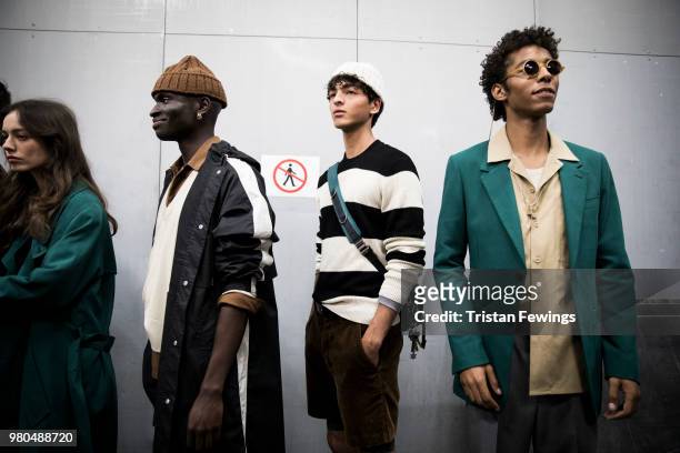 Models pose backstage prior the Ami Alexandre Mattiussi Menswear Spring Summer 2019 show as part of Paris Fashion Week on June 21, 2018 in Paris,...