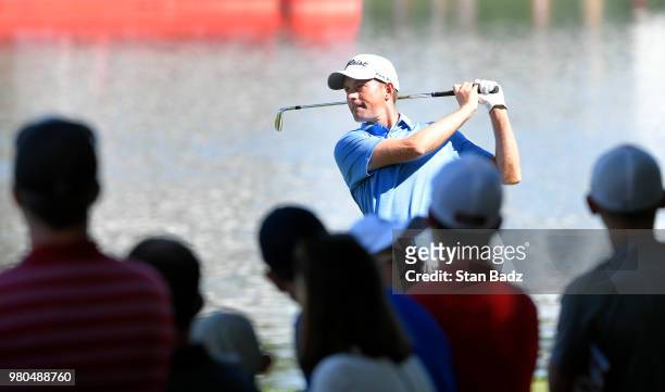 Webb Simpson plays a shot on the 16th hole during the first round of the Travelers Championship at TPC River Highlands on June 21, 2018 in Cromwell,...