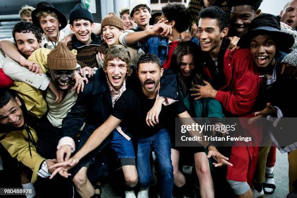 Designer Alexandre Mattiussi poses backstage with models after the Ami Alexandre Mattiussi Menswear Spring Summer 2019 show as part of Paris Fashion...