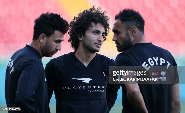 Egypt's forward Mahmoud 'Trezeguet' Hassan, Egypt's midfielder Amr Warda and Egypt's defender Ahmed Elmohamady attend a training session at the...