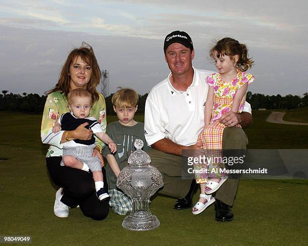 Todd Hamilton poses with his family after winning the Honda Classic, March 14, 2004 at Palm Beach Gardens, Florida. Wife, Jacque; five-year-old...
