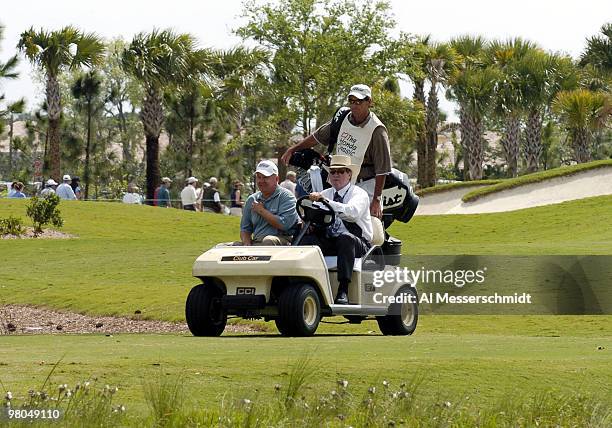 Billy Mayfair receives a ride to the first tee in the final round of the Honda Classic, March 14, 2004 at Palm Beach Gardens, Florida.