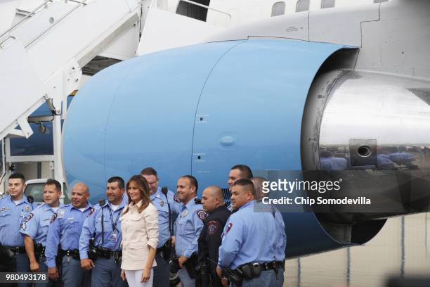 First lady Melania Trump poses for photographs with U.S. Border Patrol agents and McAllen police officers at McAllen Miller International Airport...