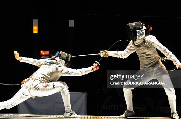 Venezuelan Mariana Gonzalez and Yulitza Suarez compete in the women's fencing foil event during the IX South American Games in Medellin, Antioquia...