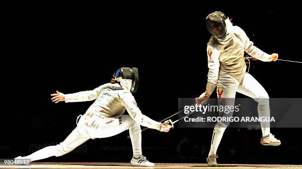 Venezuelan Mariana Gonzalez and Yulitza Suarez compete in the women's fencing foil event during the IX South American Games in Medellin, Antioquia...