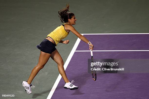 Sorana Cirstea of Romania serves against Venus Williams of the United States during day three of the 2010 Sony Ericsson Open at Crandon Park Tennis...