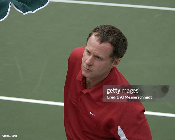 United States captain Patrick McEnroe watches play during the Davis Cup quarter finals in Delray Beach, Florida April 9 , 2004.