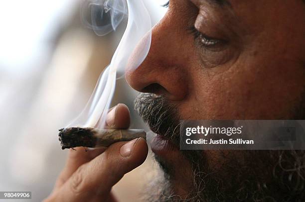 Medicinal marijuana user Dave Karp smokes marijuana at the Berkeley Patients Group March 25, 2010 in Berkeley, California. California Secretary of...