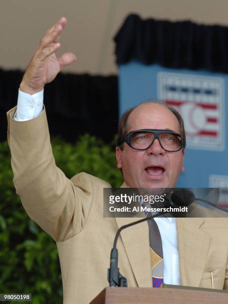 Catcher Johnny Bench leads fans in a rendition of "Take Me Out to the Ballgame" during 2004 Baseball Hall of Fame induction ceremonies July 25, 2004...